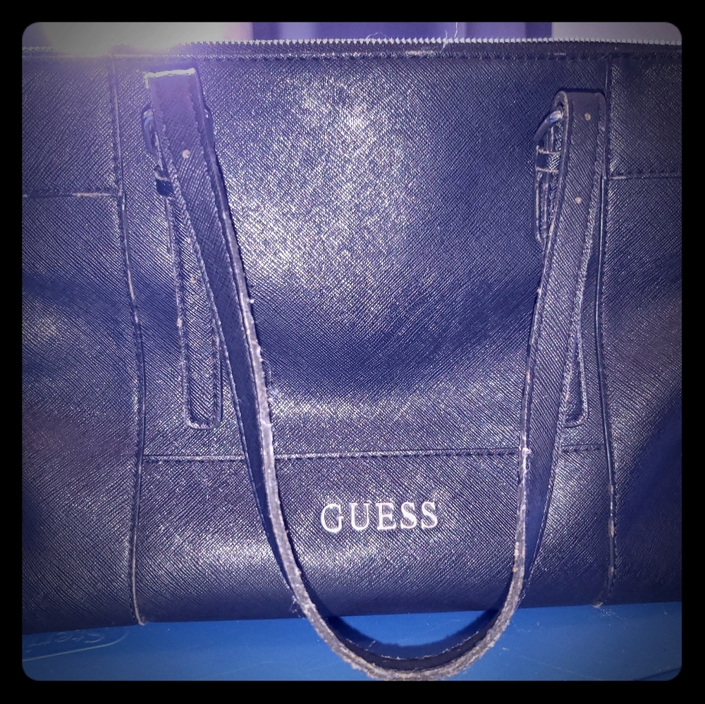 Guess brand black pebble.letter handbag